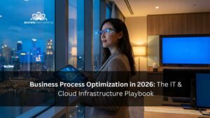 A woman in a corporate office overlooking a night city skyline using a tablet for business process optimization and IT cloud infrastructure management in 2026.